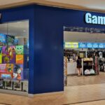 GameStop posts lower sales, reduced losses