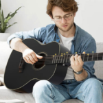 This 0 smart guitar has an app and light-up fretboard