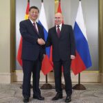 Smiling Putin is reunited with his ‘old friend’ President Xi as the pair meet to discuss bringing down the West and opposing US-led democratic world order